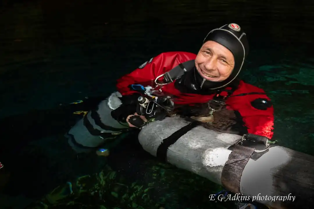 Cenote guide in the water before a dive
